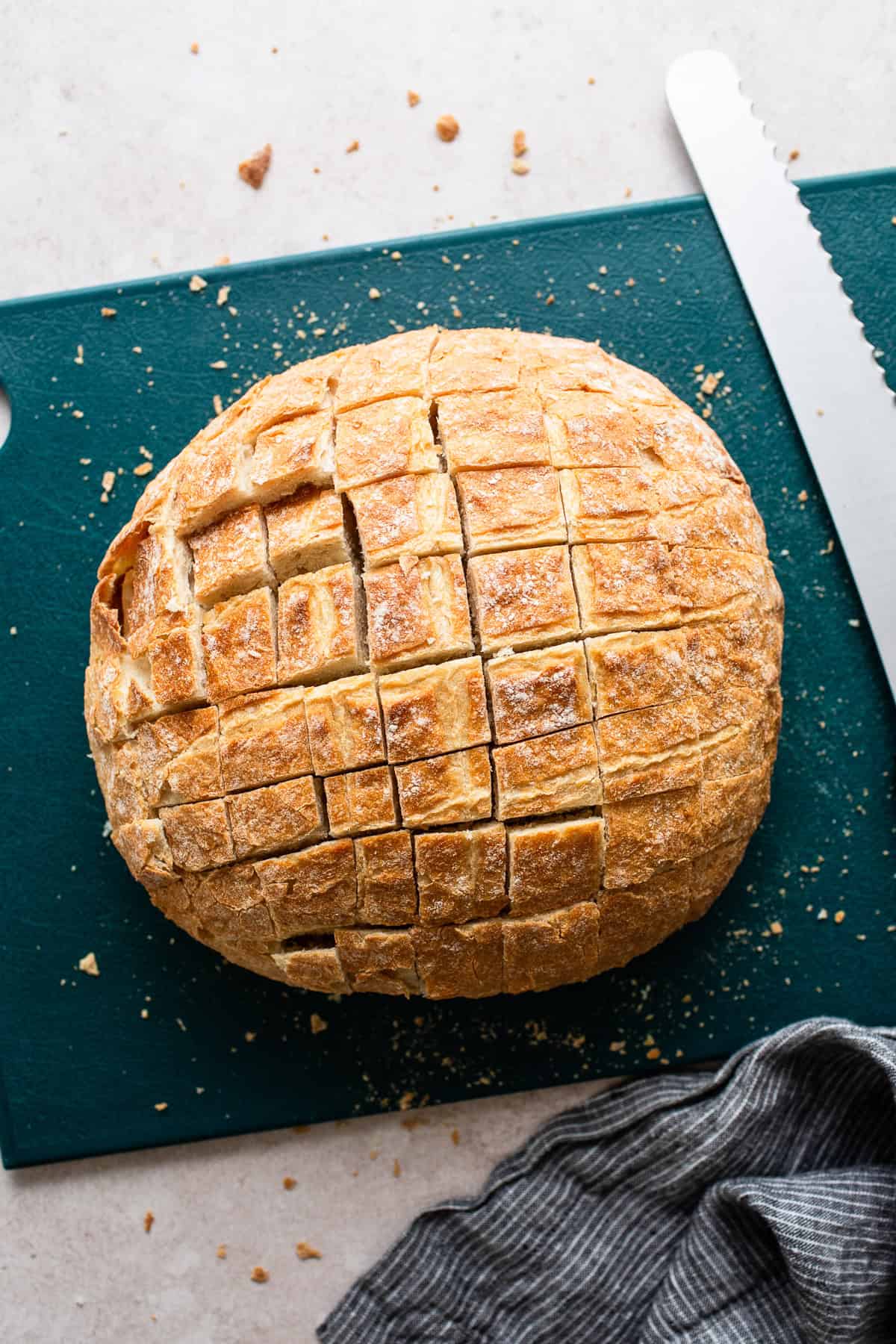 Cut the bread loaf into a grid pattern, not cutting all the way through.