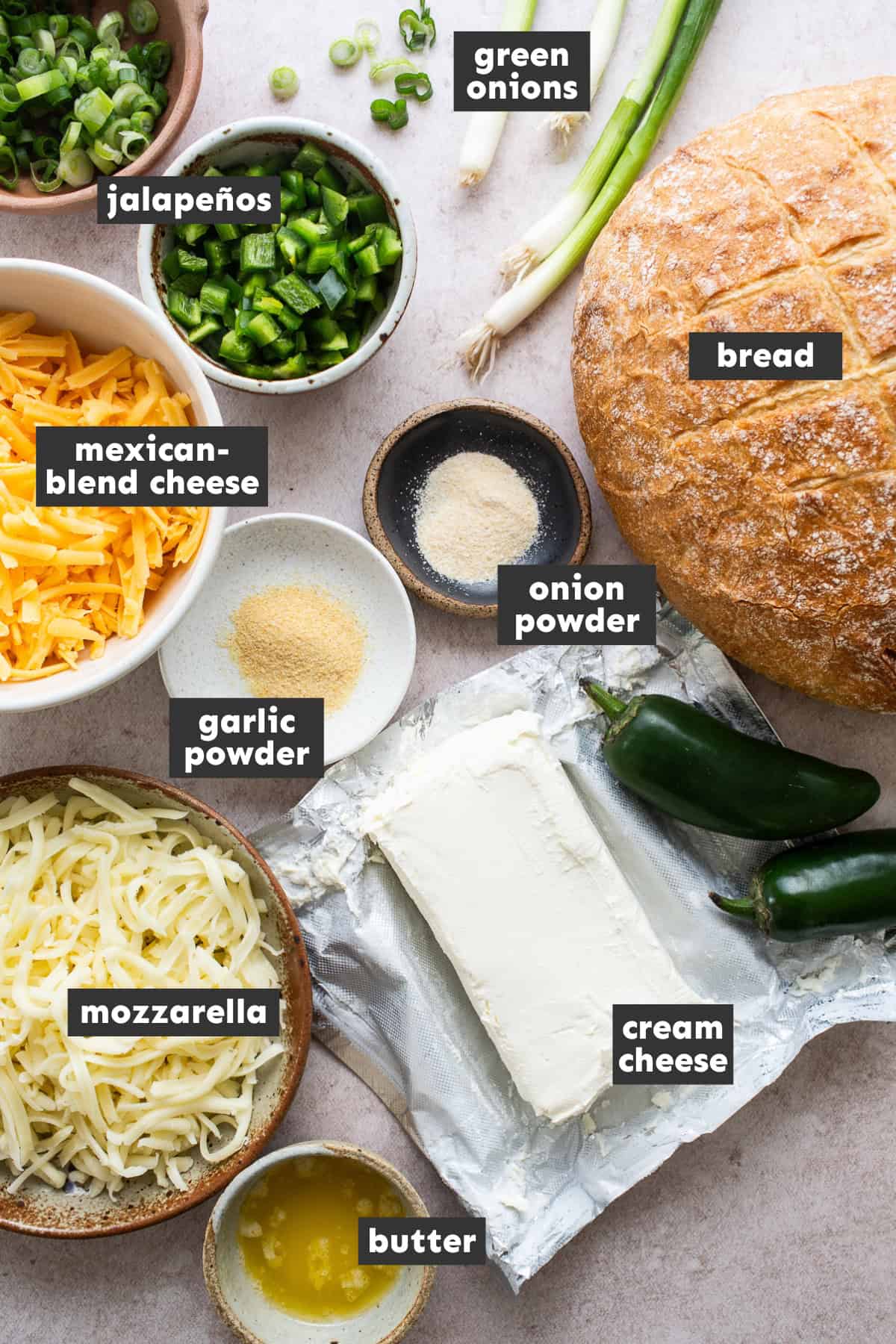 Ingredients laid out on a table ready to make jalapeno popper pull apart bread.