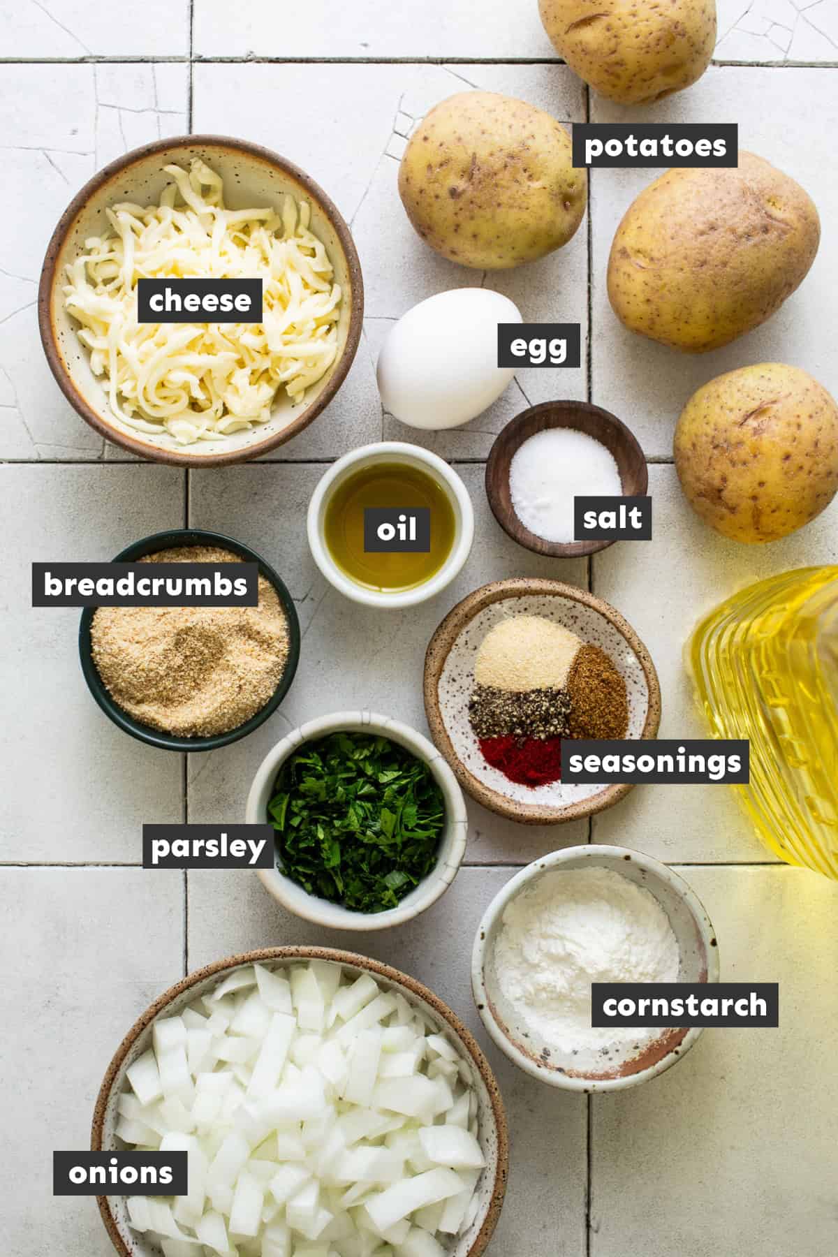 Ingredients for tortitas de papa laid out on a table ready to use.