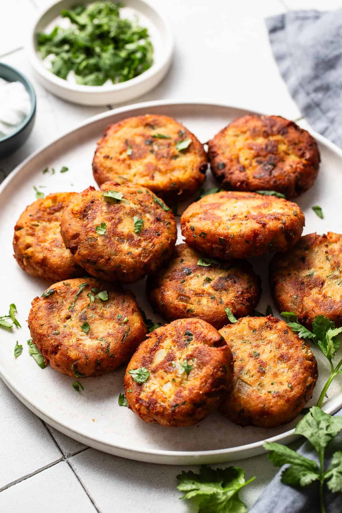 Tortitas de papa set on a serving plate ready to eat.