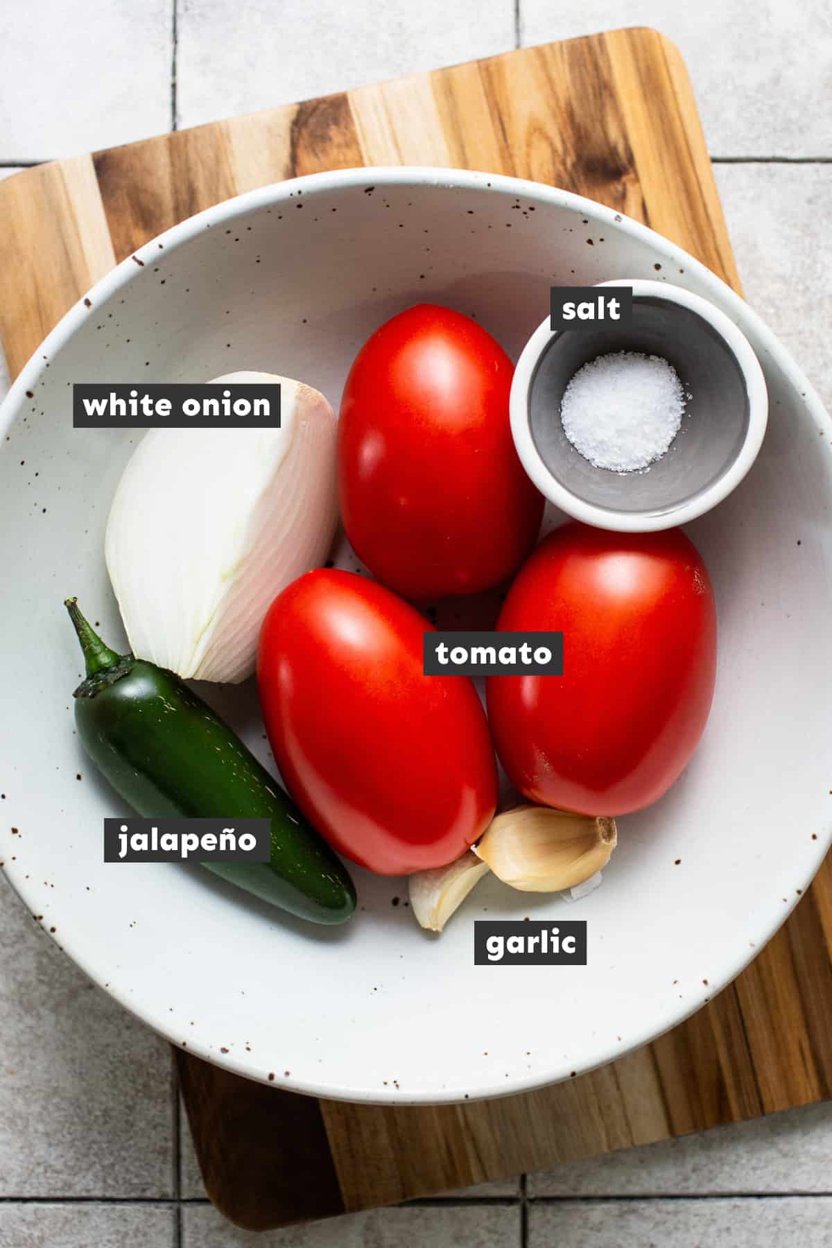 Ingredients for molcajete salsa on a table.